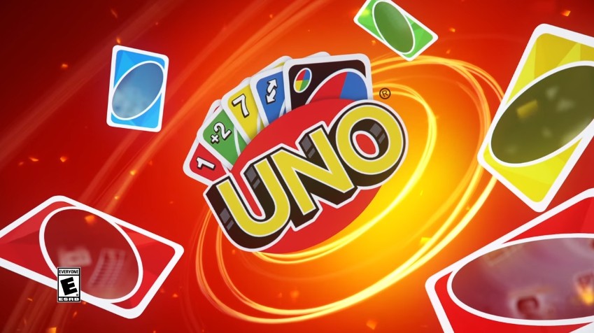 muitos cartões de jogo uno coloridos sobre fundo vermelho. uno é